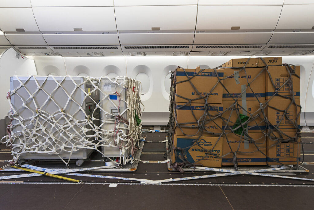 Example of a preighter - A picture of cargo loaded onto a passenger aircraft after having removed the passenger seats. 